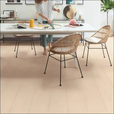 Beige painted oak rose laminate flooring from quickstep capture collection with smooth matte finish and subtle grain texture