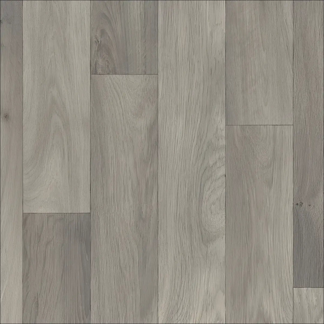 Gray wood-plank laminate flooring with natural grain pattern in caspien sheet vinyl felt backed for realistic wood look