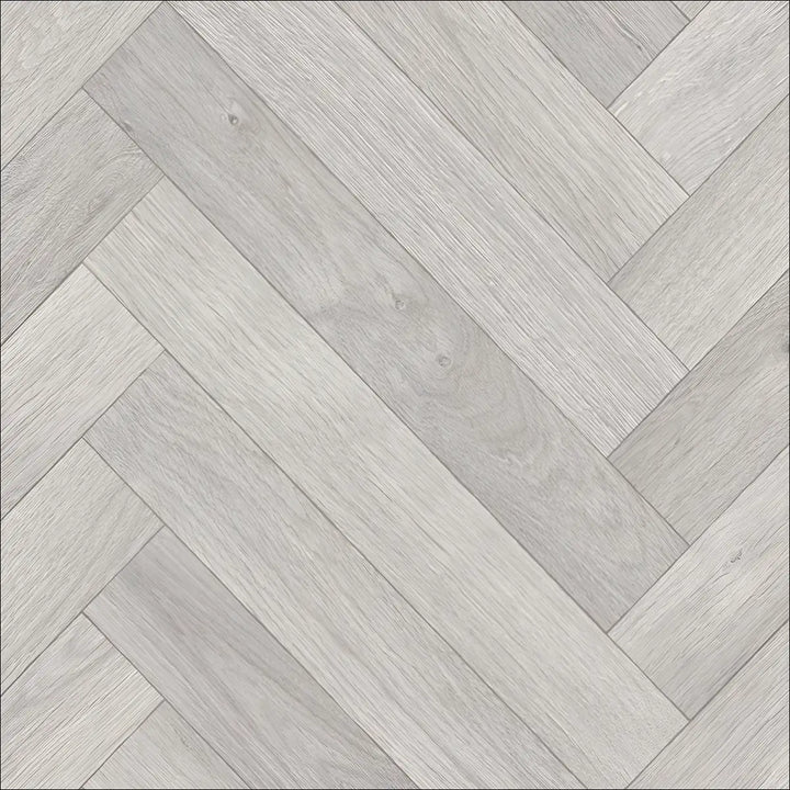 Light gray caspien sheet vinyl flooring with a realistic wood herringbone pattern and a felt backed design