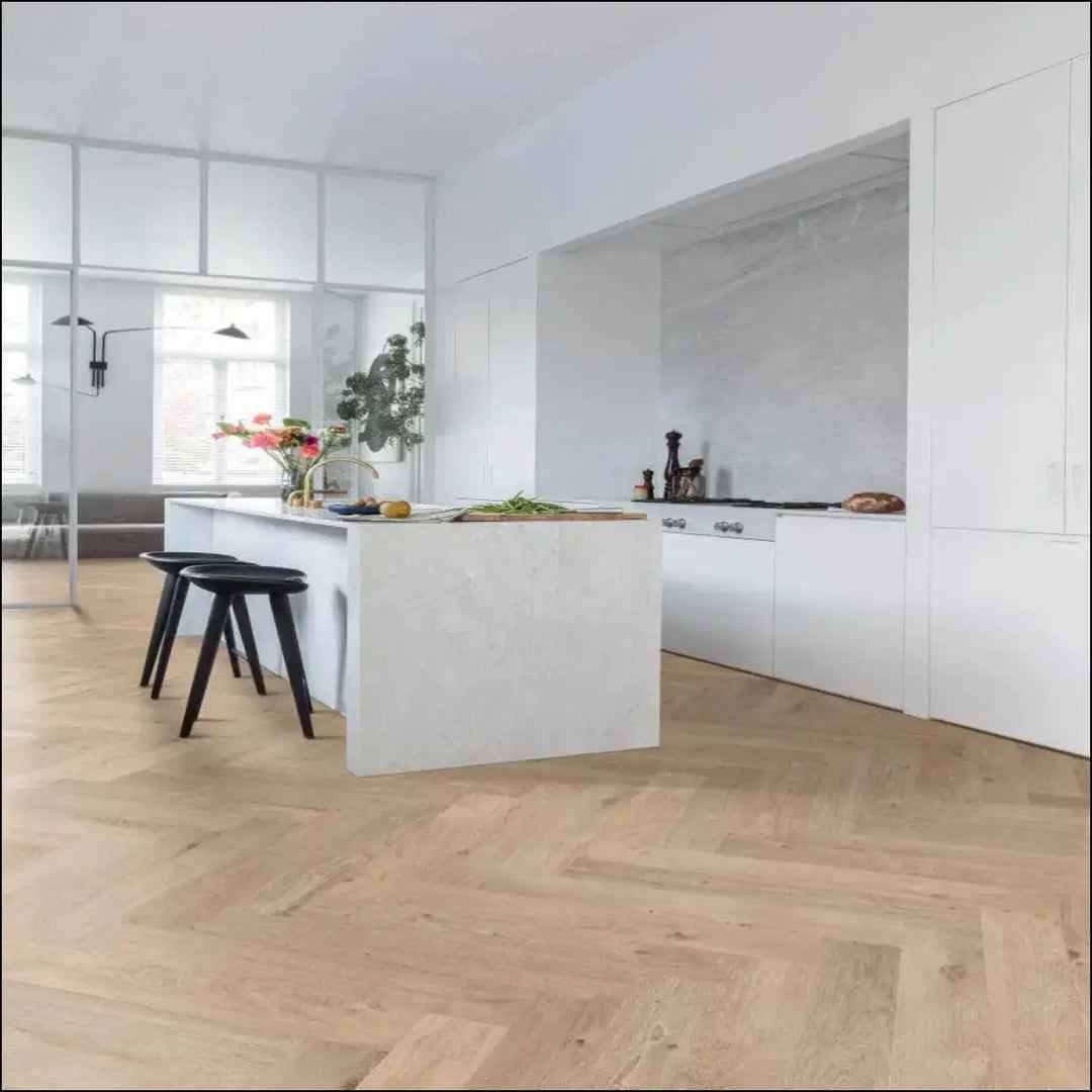 White kitchen island with integrated sink on smooth floorify vinyl herringbone flooring unagi f317 in minimalist style