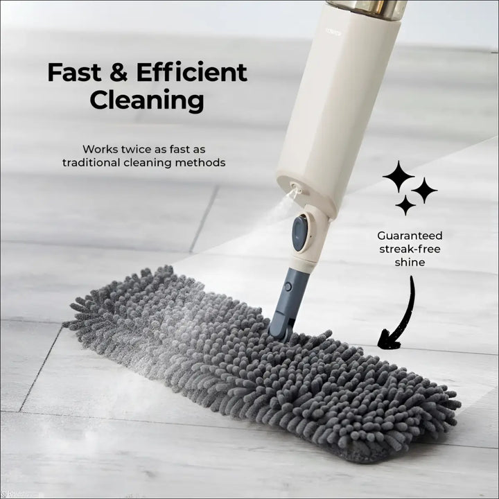 Gray plush microfiber pad attached to a white and gray multi-surface spray mop with a swivel head for easy cleaning