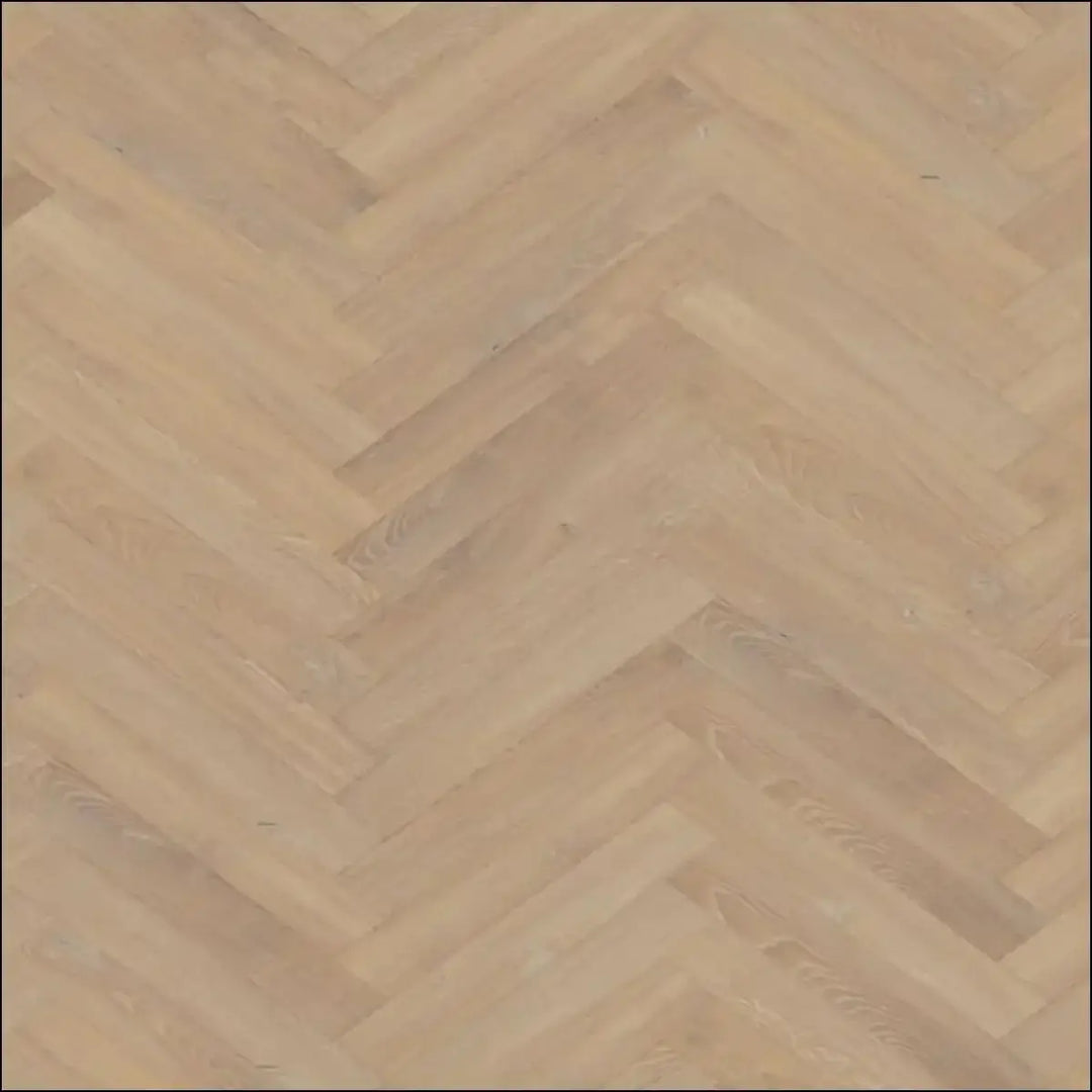 Light-colored premium 12mm herringbone laminate flooring in sandy oak with a stylish hardwood pattern