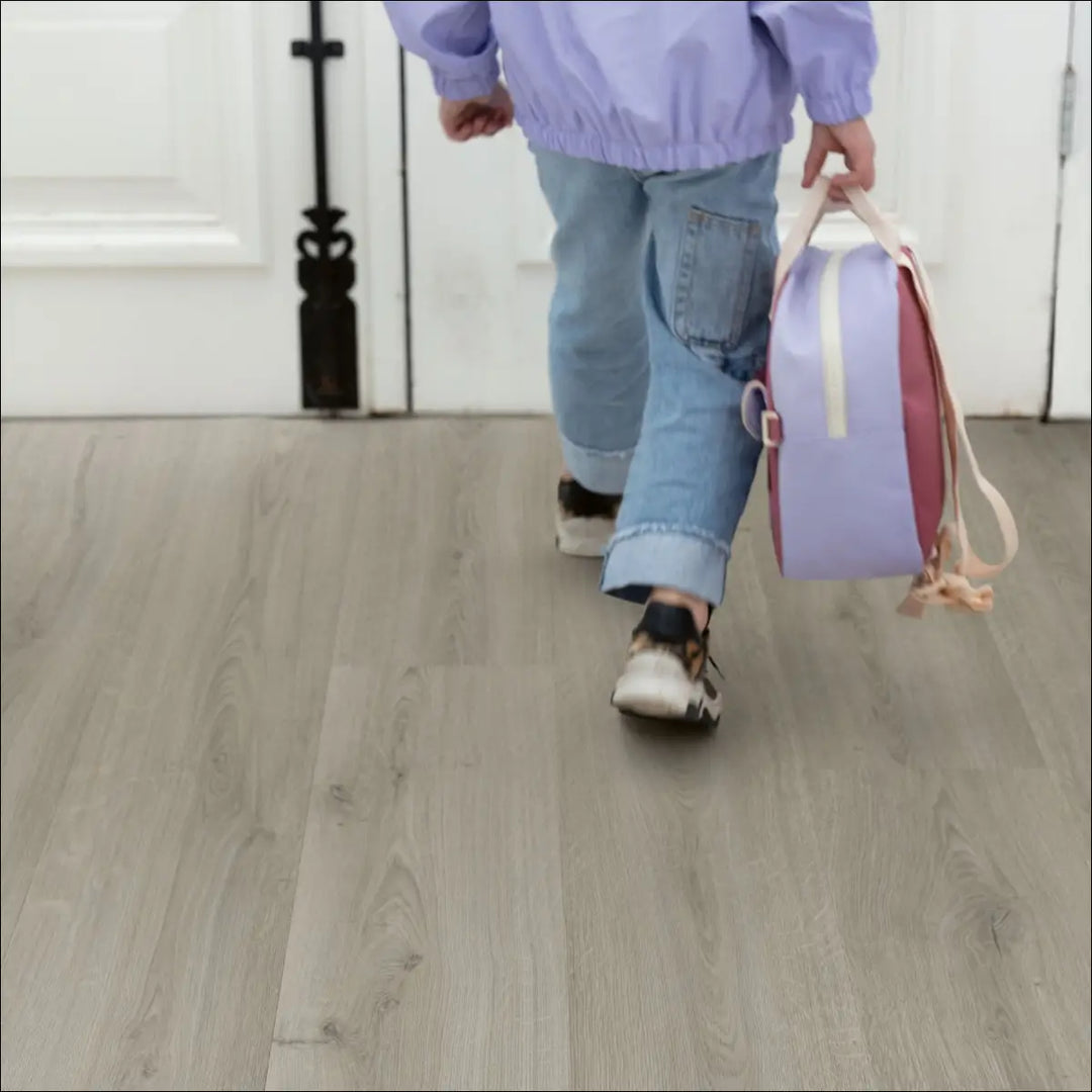 Quick Step Bloom Botanic Grey Luxury Vinyl Flooring AVMPU40237 with Child in Hallway