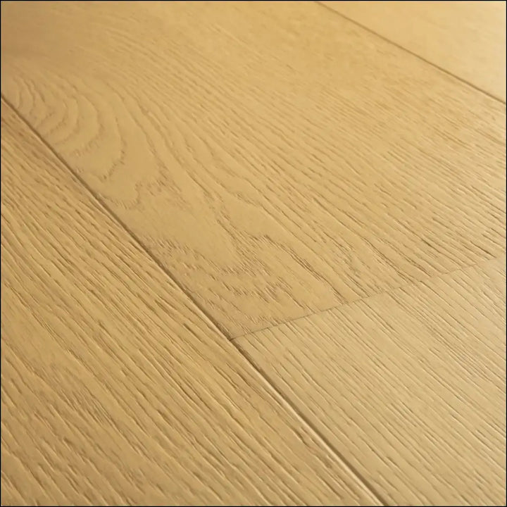 Light oak quick-step cala leather oak extra matt hardwood flooring showing natural grain and visible plank seams