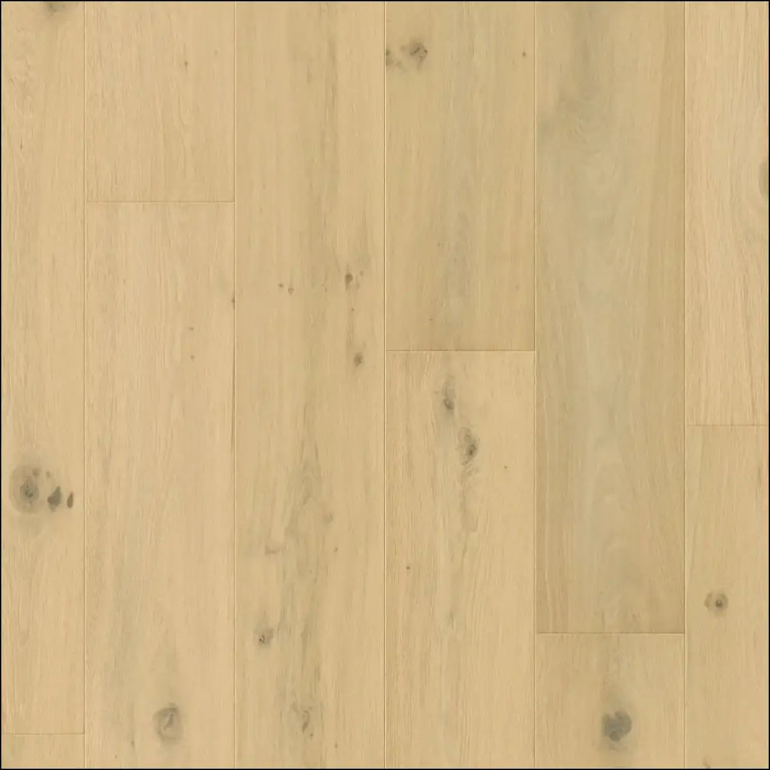 Light-colored quick-step cala pearl white oak extra matt hardwood flooring with natural grain and subtle knots