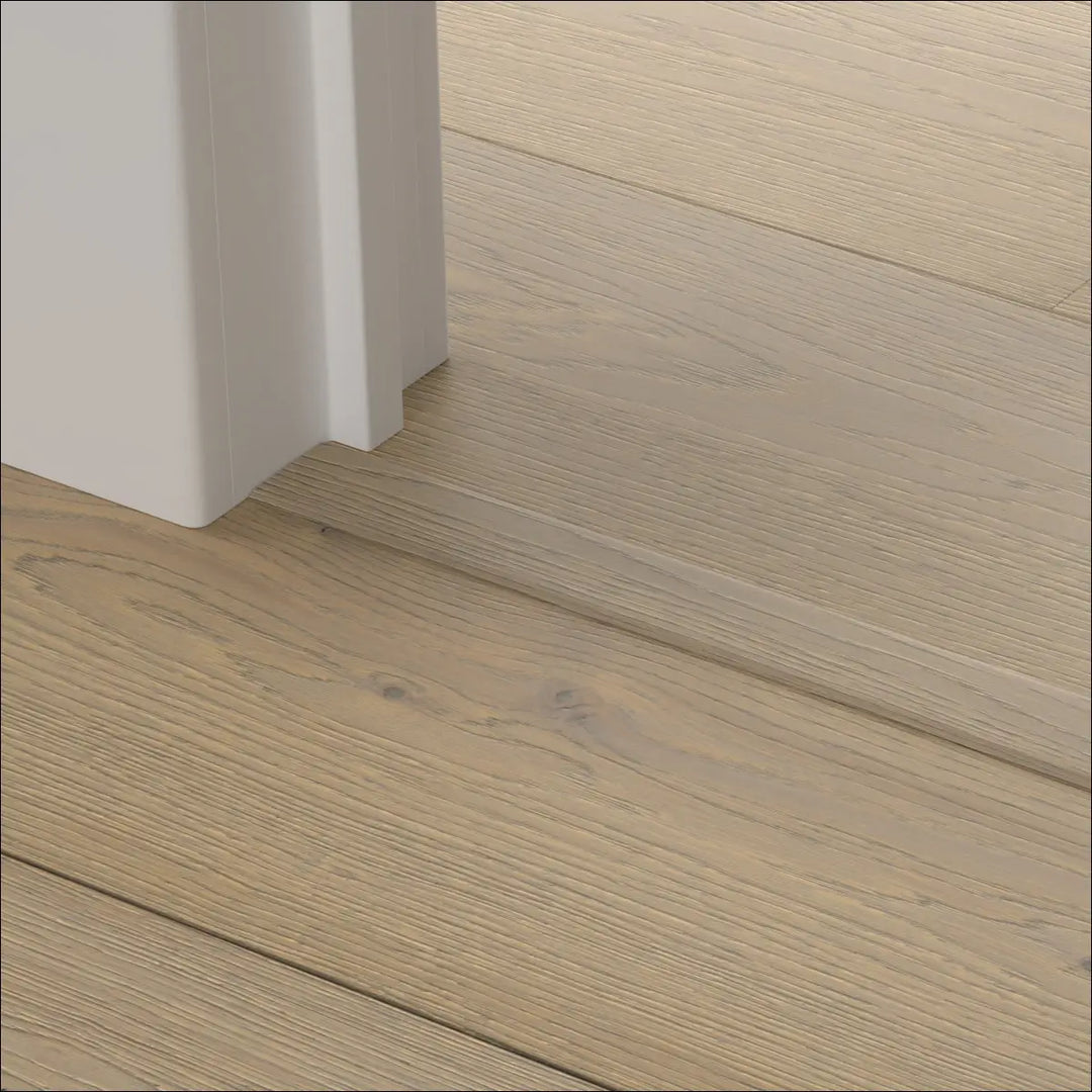 Light beige quick step cascada incizo profile wood plank flooring with subtle natural grain and stair nosing detail