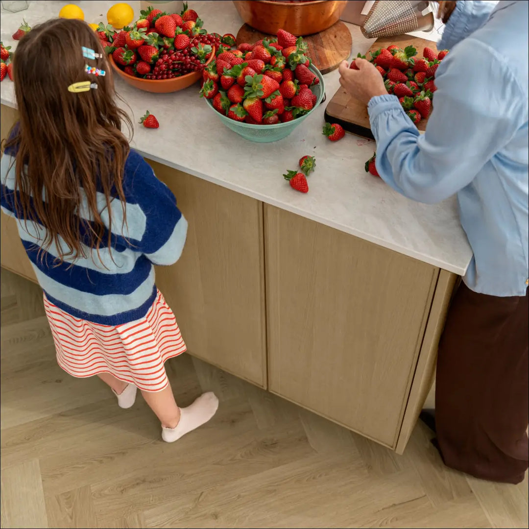 Quick Step Ciro Botanic Beige Herringbone Vinyl Flooring AVHBU40362 Close Up with Child
