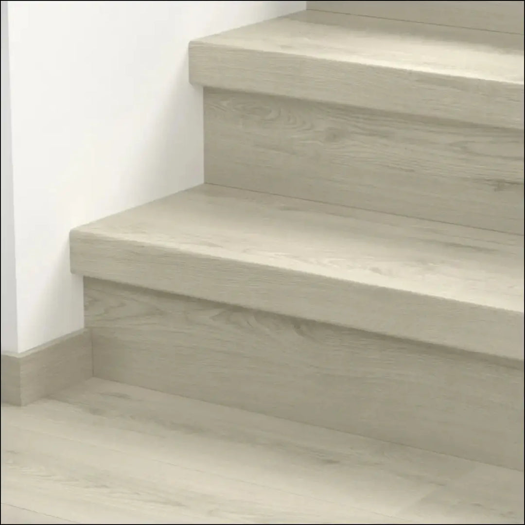 Modern light gray concrete quick step classic stair cover with subtle wood grain texture for classic laminate flooring