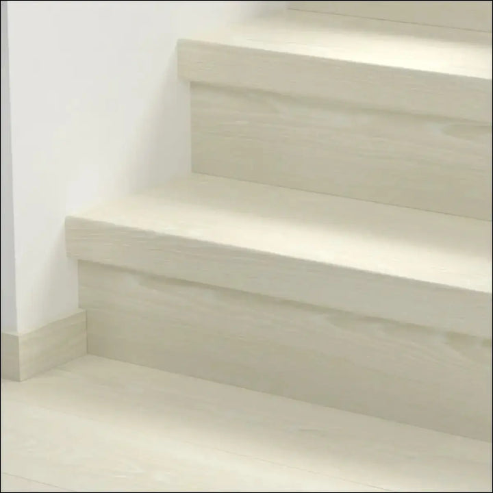 Beige concrete quick step classic stair cover with minimalist design and clean modern lines for classic laminate flooring