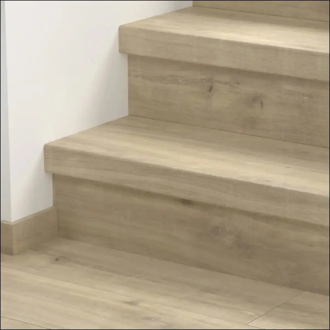 Light beige quick step classic stair cover with smooth natural grain finish made of classic laminate flooring