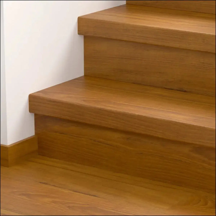 Modern wooden staircase with warm natural finish featuring quick step classic stair cover in classic laminate flooring style