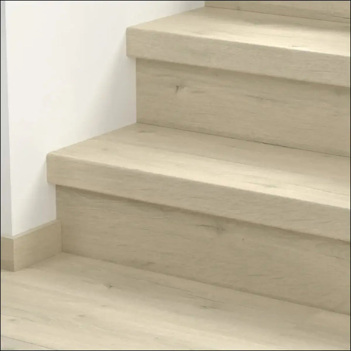 Light beige quick step classic stair cover with smooth modern finish on wooden stairs for classic laminate flooring