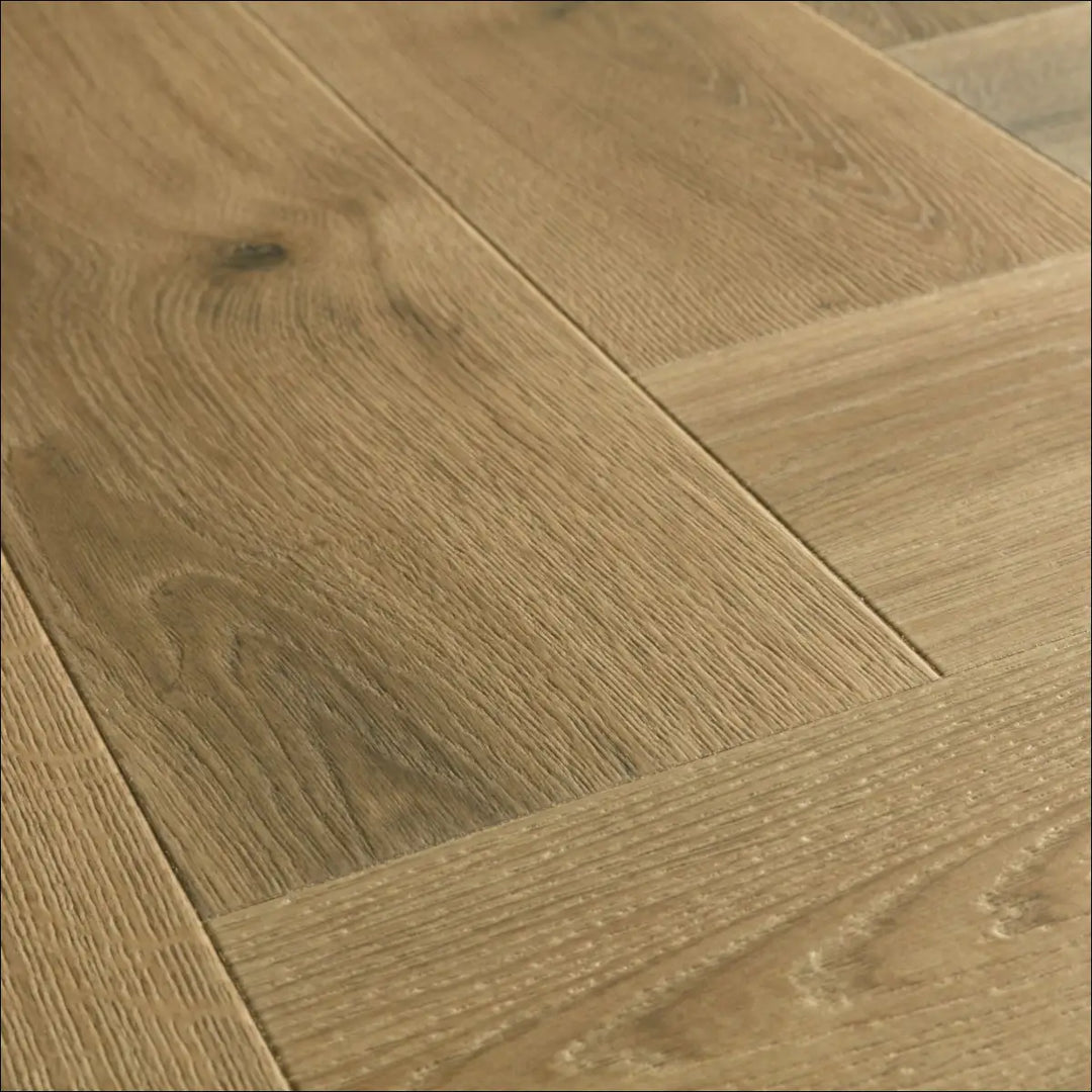 Quick-step impressive charred oak herringbone laminate with light oak color and natural wood grain pattern
