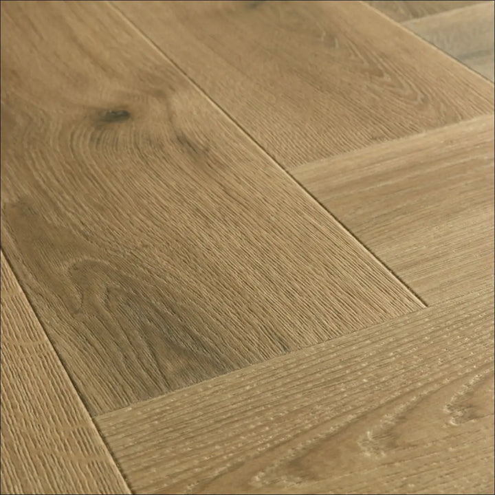 Quick-step impressive charred oak herringbone laminate with light oak color and natural wood grain pattern