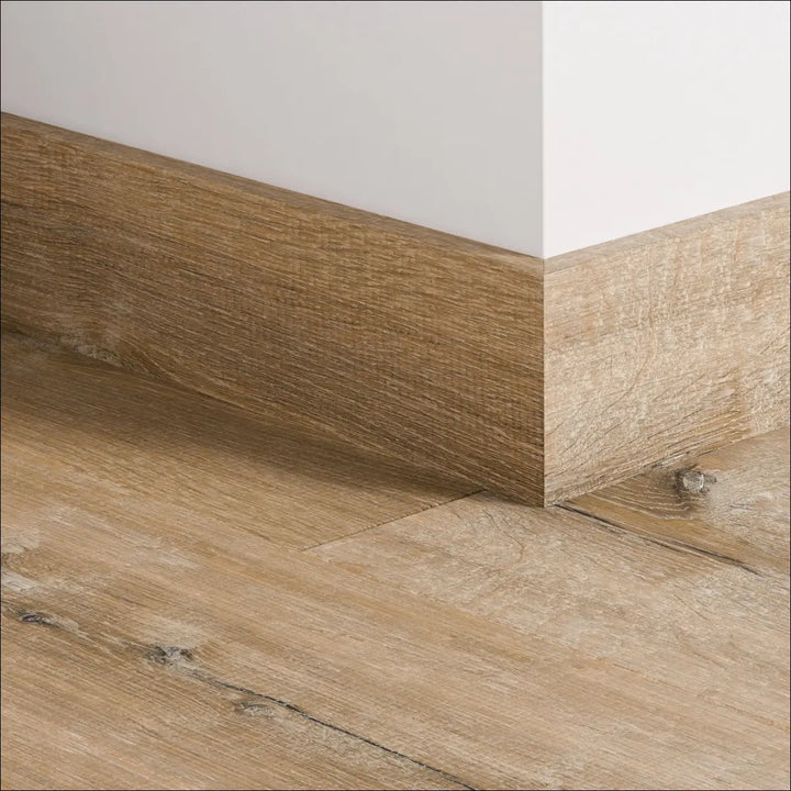 Light brown wood-grain quickstep impressive 77mm skirting board with natural textured finish for stylish baseboards