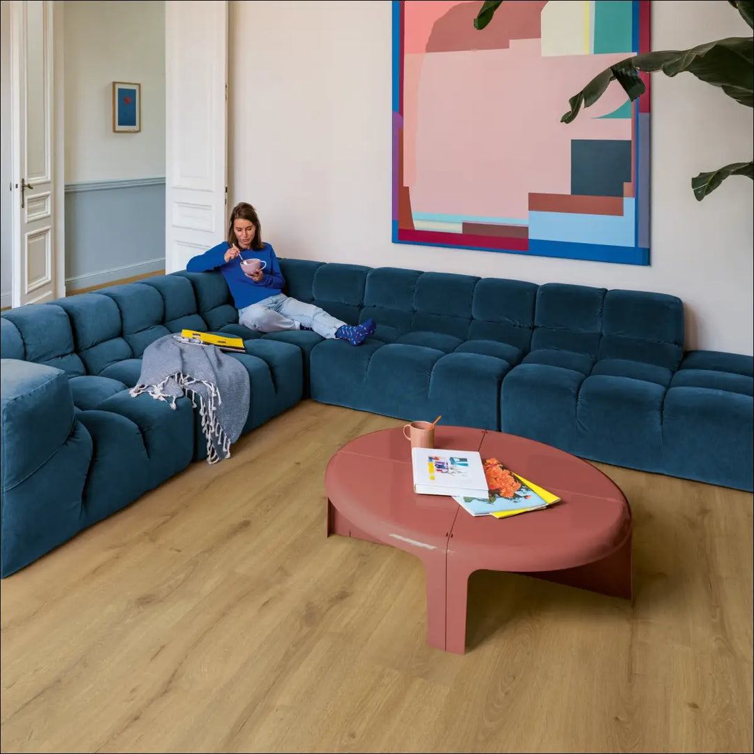 Quick Step Majestic Desert Oak Warm Natural Laminate Flooring MJ3551 Lounge with Blue Sofa
