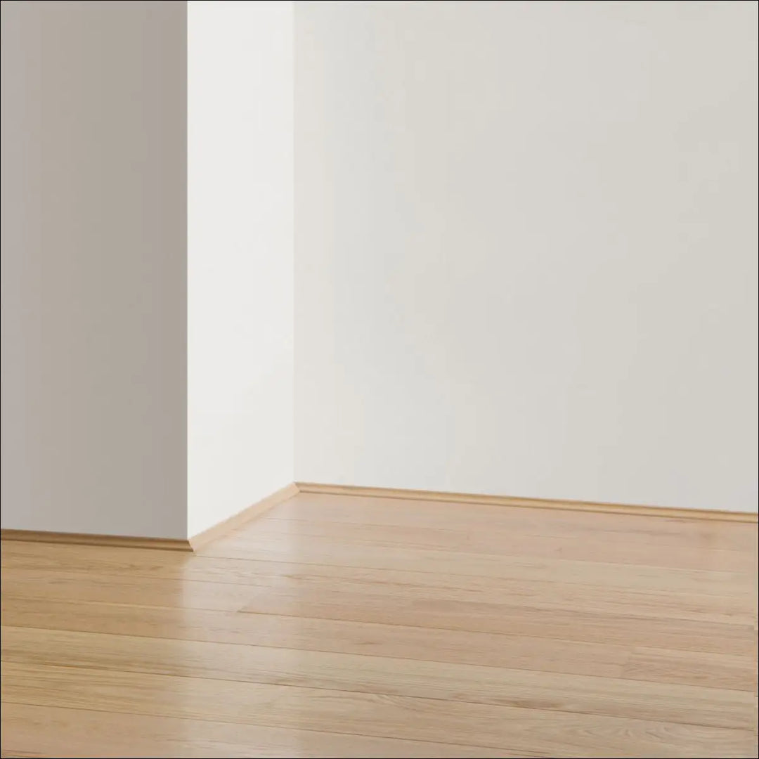 Light-colored quickstep cala wooden floor with matching cala scotia beading and existing skirting boards on white walls