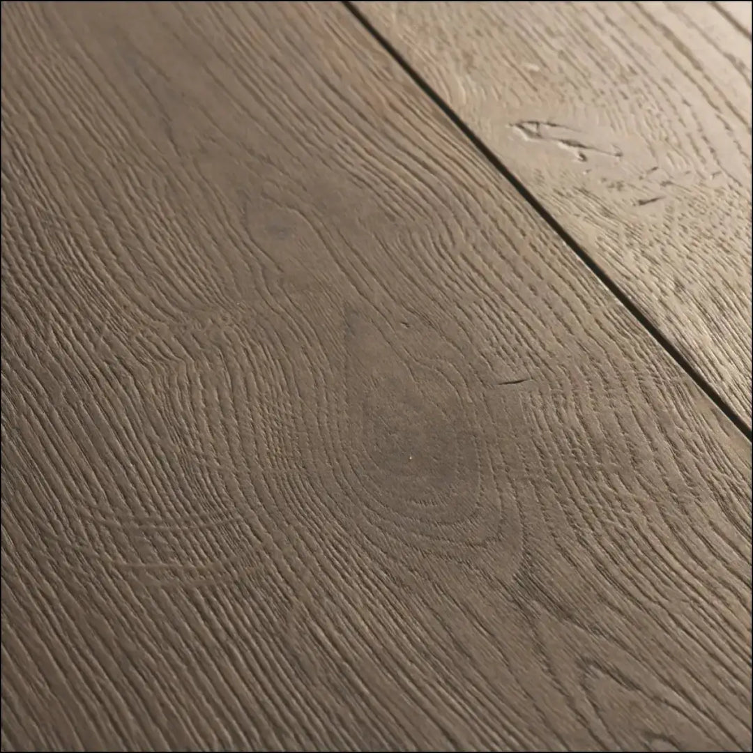 Dark gray quickstep capture laminate brushed oak brown flooring with natural grain pattern and subtle texture