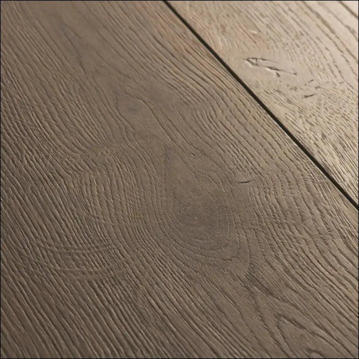 Dark gray quickstep capture laminate brushed oak brown flooring with natural grain pattern and subtle texture