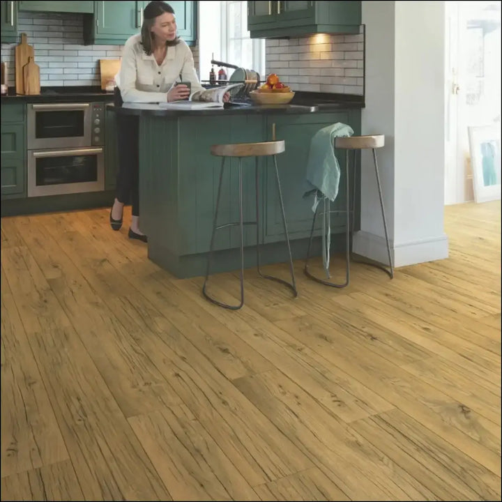 Quickstep capture laminate cracked oak natural flooring with warm tone wood planks and natural grain pattern