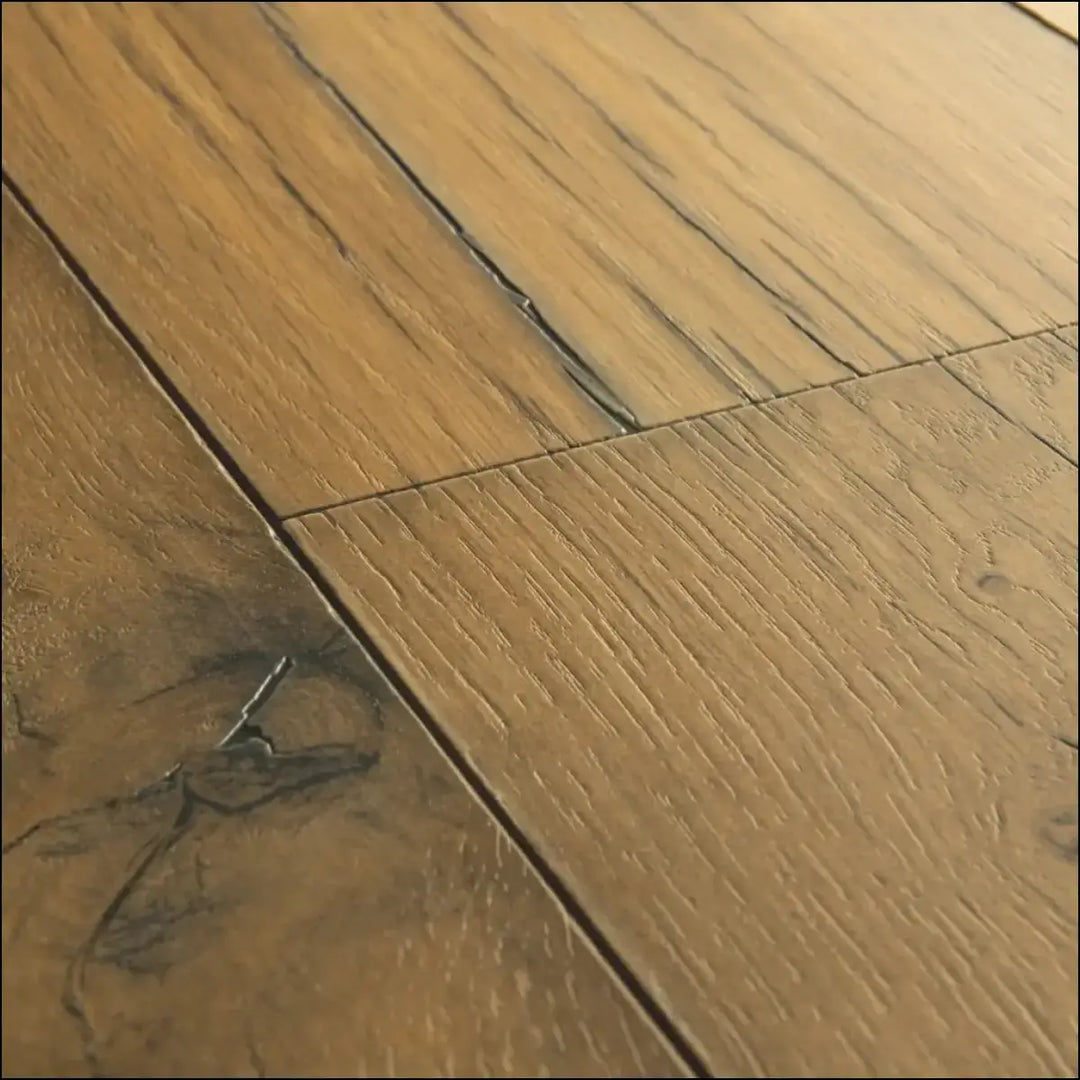 Light brown quickstep capture laminate cracked oak natural floor planks with visible wood grain and dark knots