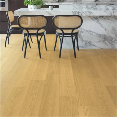 Quick-step capture laminate flooring in light oak with a smooth natural varnished oak finish and wood grain texture