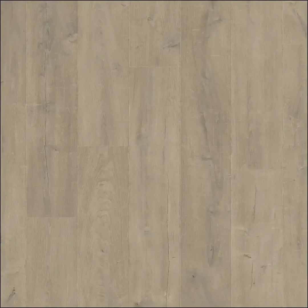 Light gray wood-plank laminate flooring with subtle grain from quickstep capture laminate patina oak brown collection