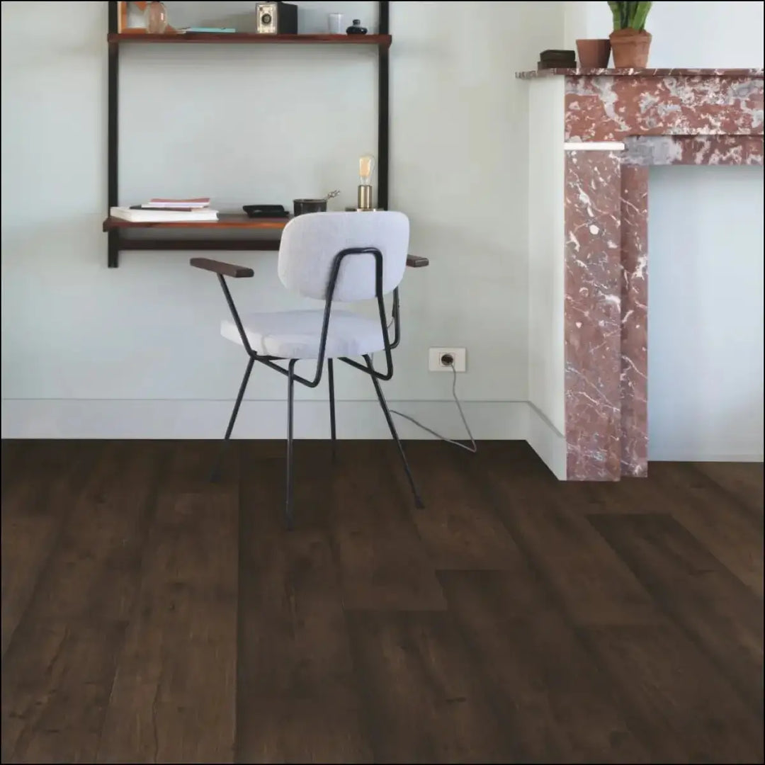 White upholstered chair with black metal frame and wooden armrests on quick-step capture waxed oak brown laminate floor