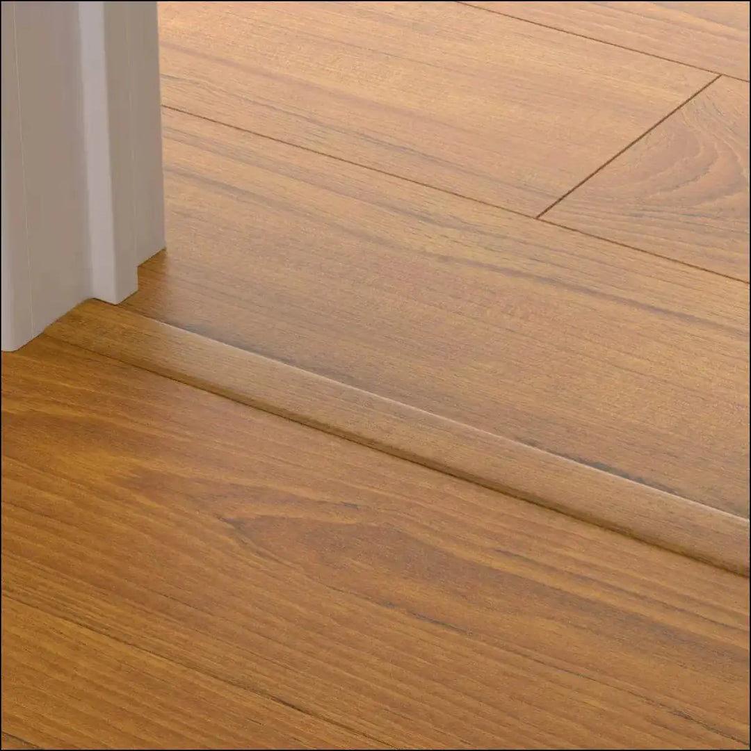 Light brown wooden floorboard with matching quickstep classic incizo profile multi-use threshold strip at doorway