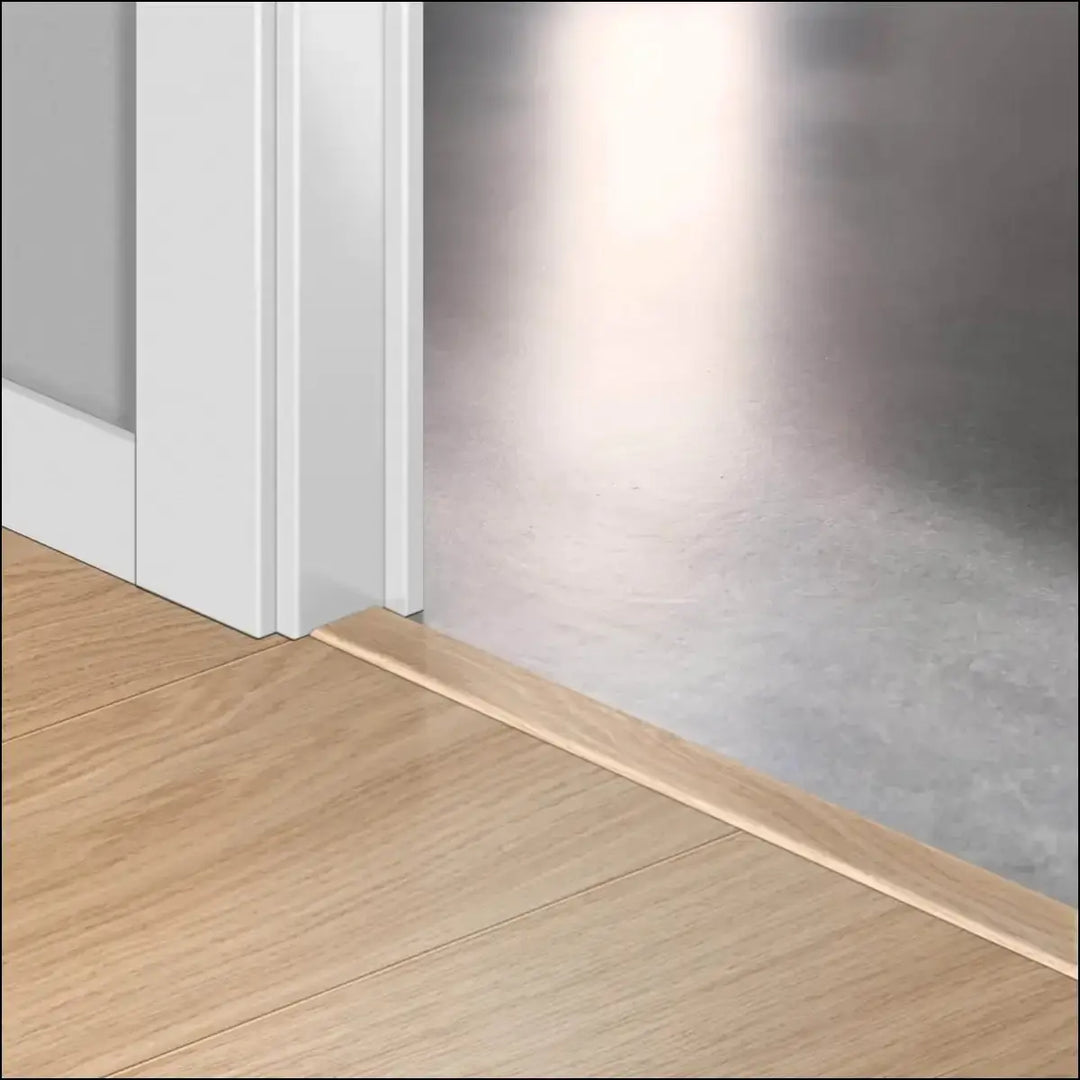 Light-colored wood floor trim with smooth polished finish featuring quickstep classic incizo profile multi-use profile