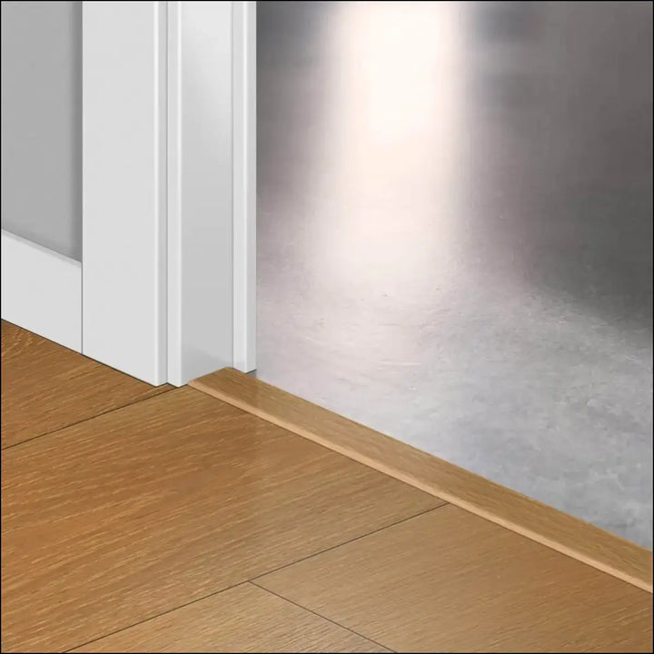 Light brown wooden floor trim with smooth finish and subtle grain in quickstep classic incizo profile multi-use profile