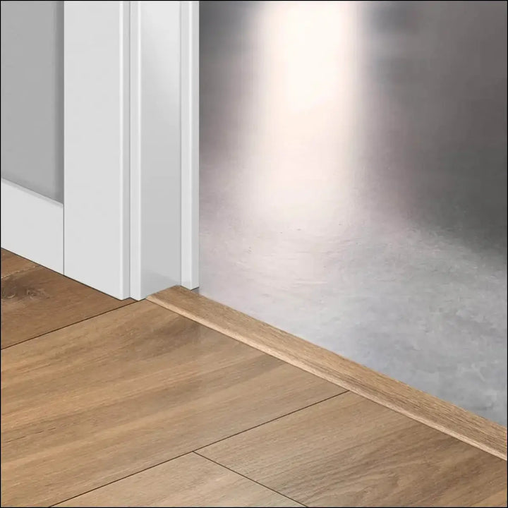 Light brown wooden floor trim with smooth finish and subtle grain in quickstep classic incizo profile multi use design