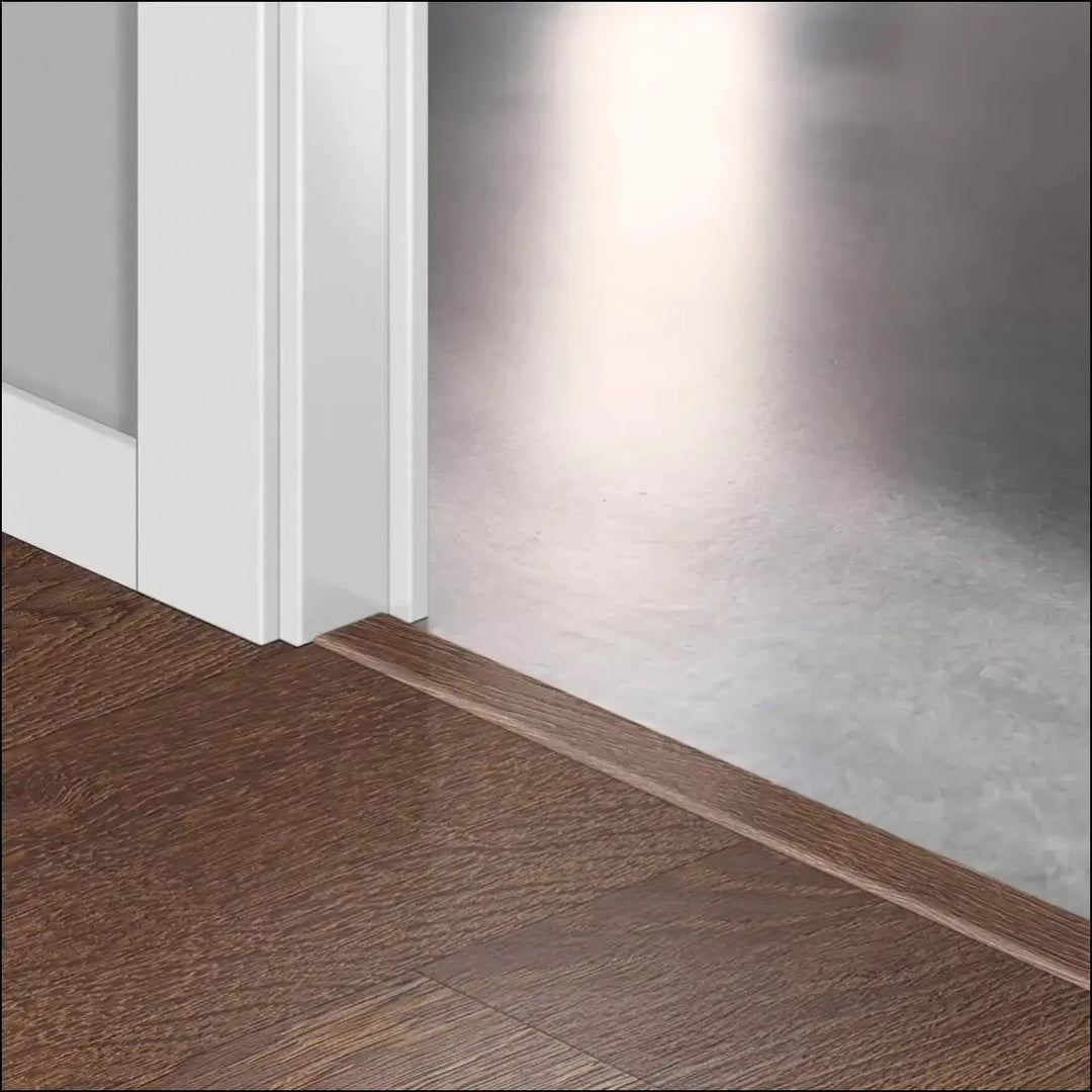 Brown wooden floor trim with smooth polished finish in quickstep classic incizo profile multi-use profile design