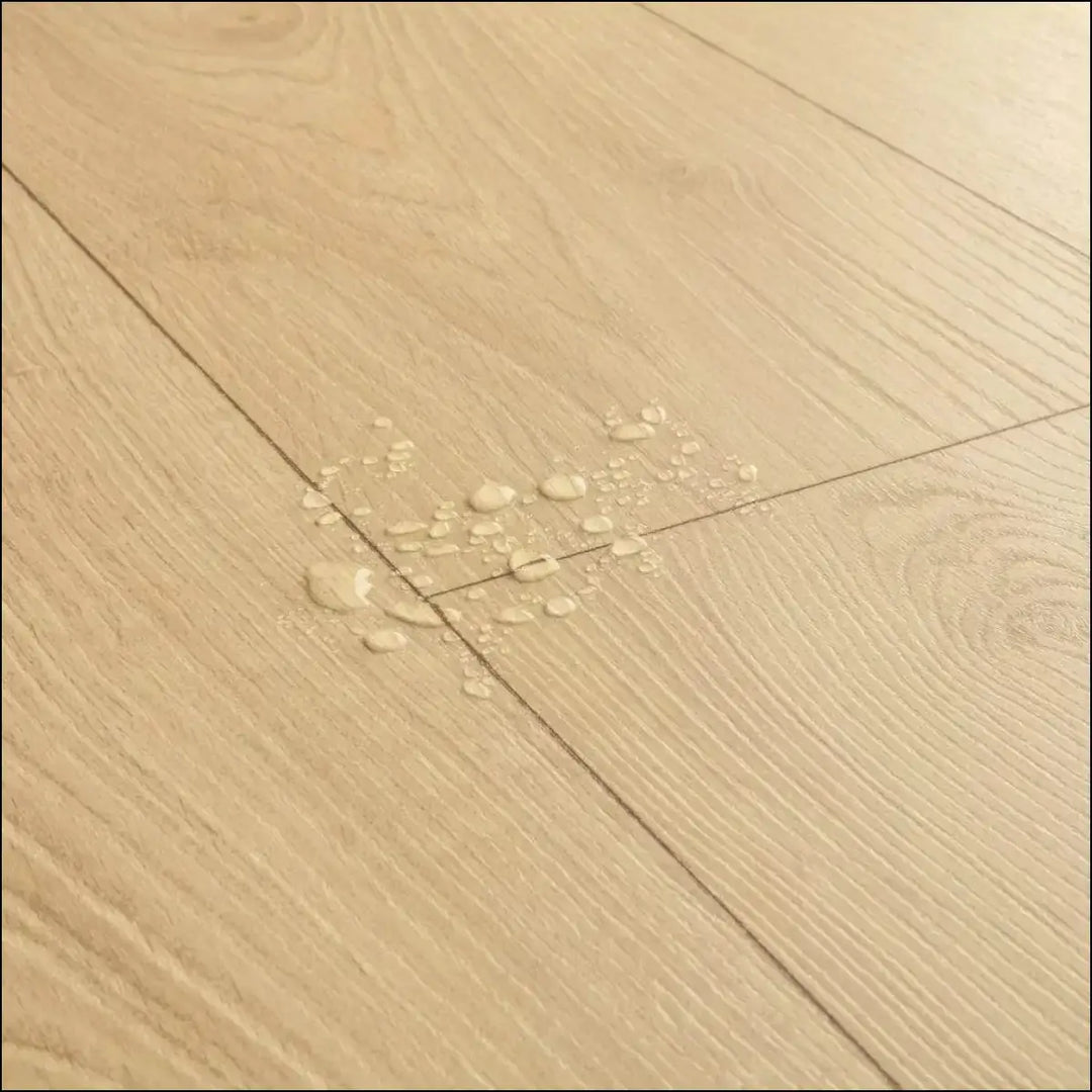 Light-colored quickstep classic laminate flooring desert greige oak greige oak clm5802 with natural grain and subtle knots
