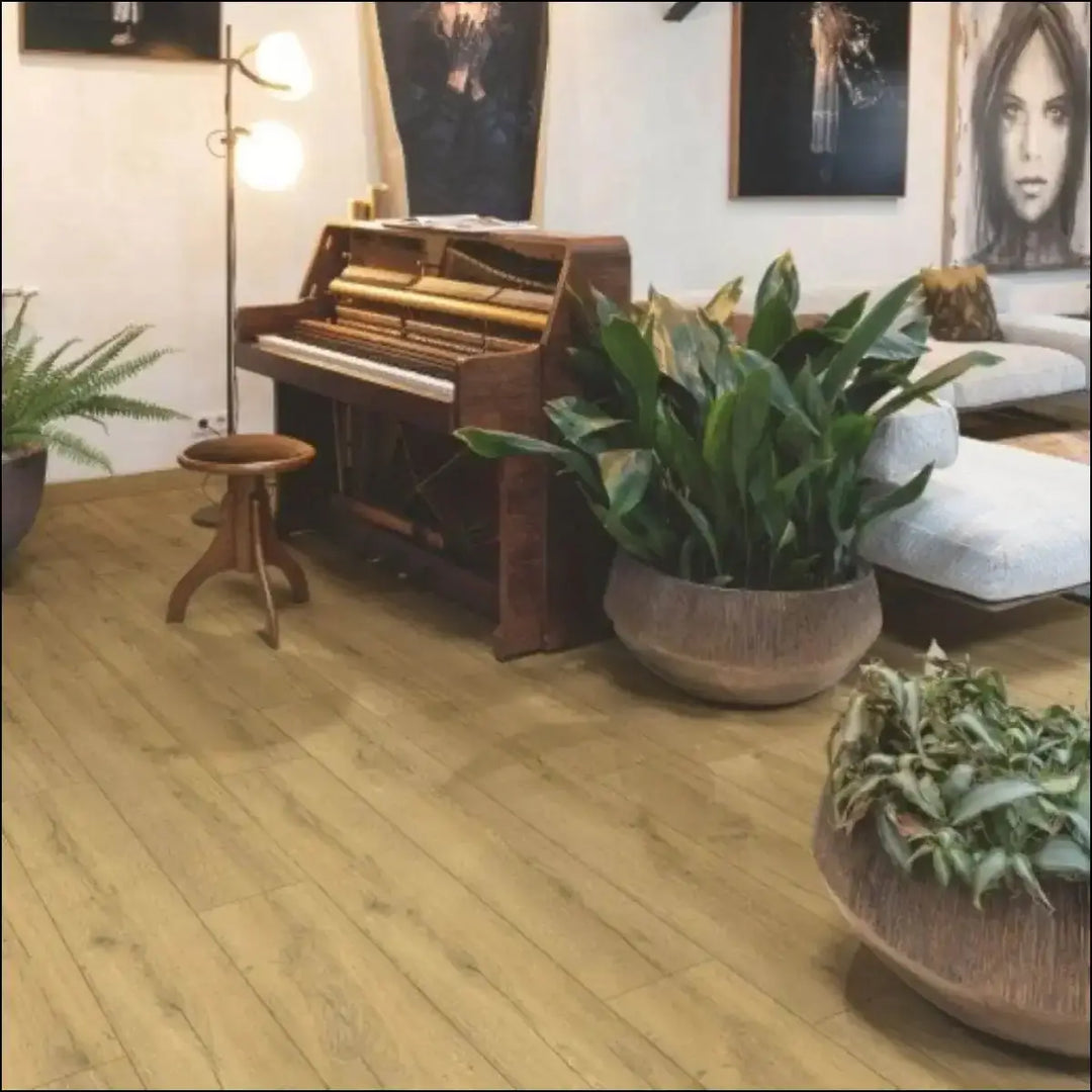 A dark brown wooden upright piano with polished finish and visible keys on quickstep classic honey brown oak flooring clm5792