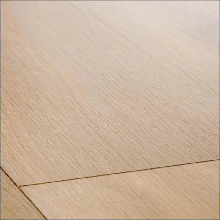 Light oak quickstep classic laminate flooring with smooth natural wood grain in midnight oak natural finish
