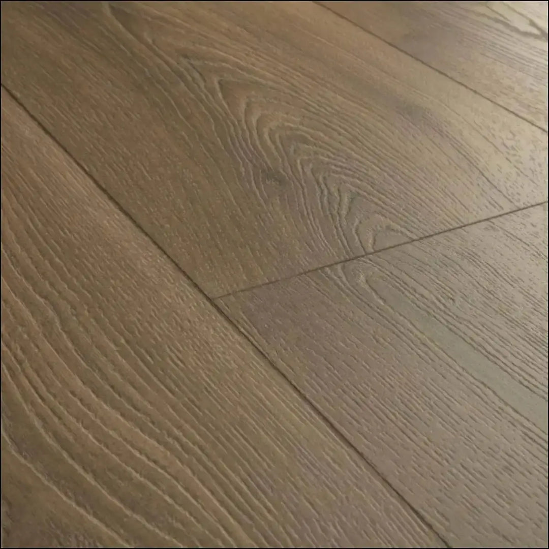 Light brown hardwood flooring with natural wood grain in quick-step classic laminate warm brown oak clm5789
