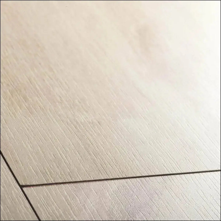 Light beige classic havana oak natural high-quality laminate flooring with subtle texture and thin black seam line