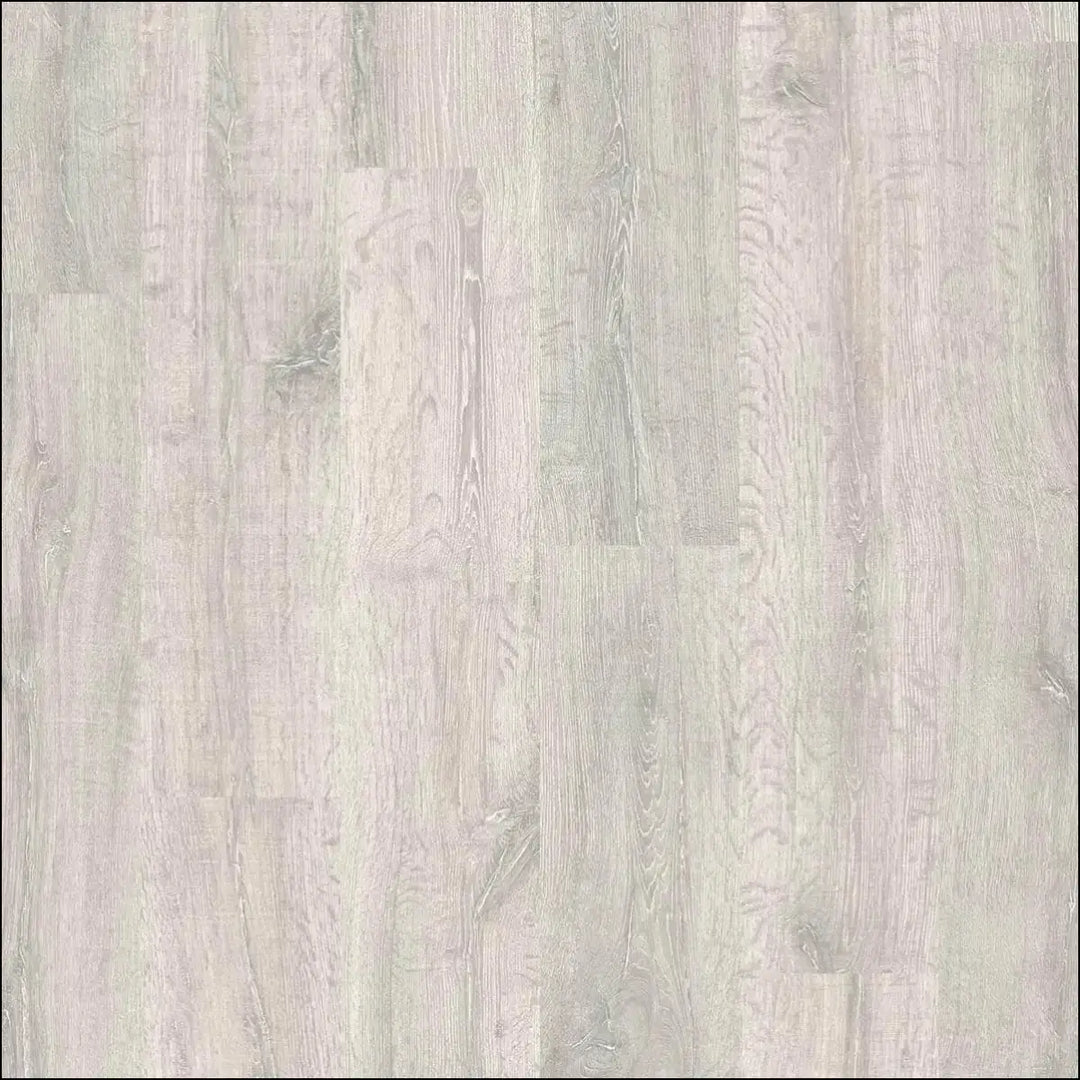 Light gray quickstep classic laminate flooring with subtle natural grain in reclaimed white patina oak style