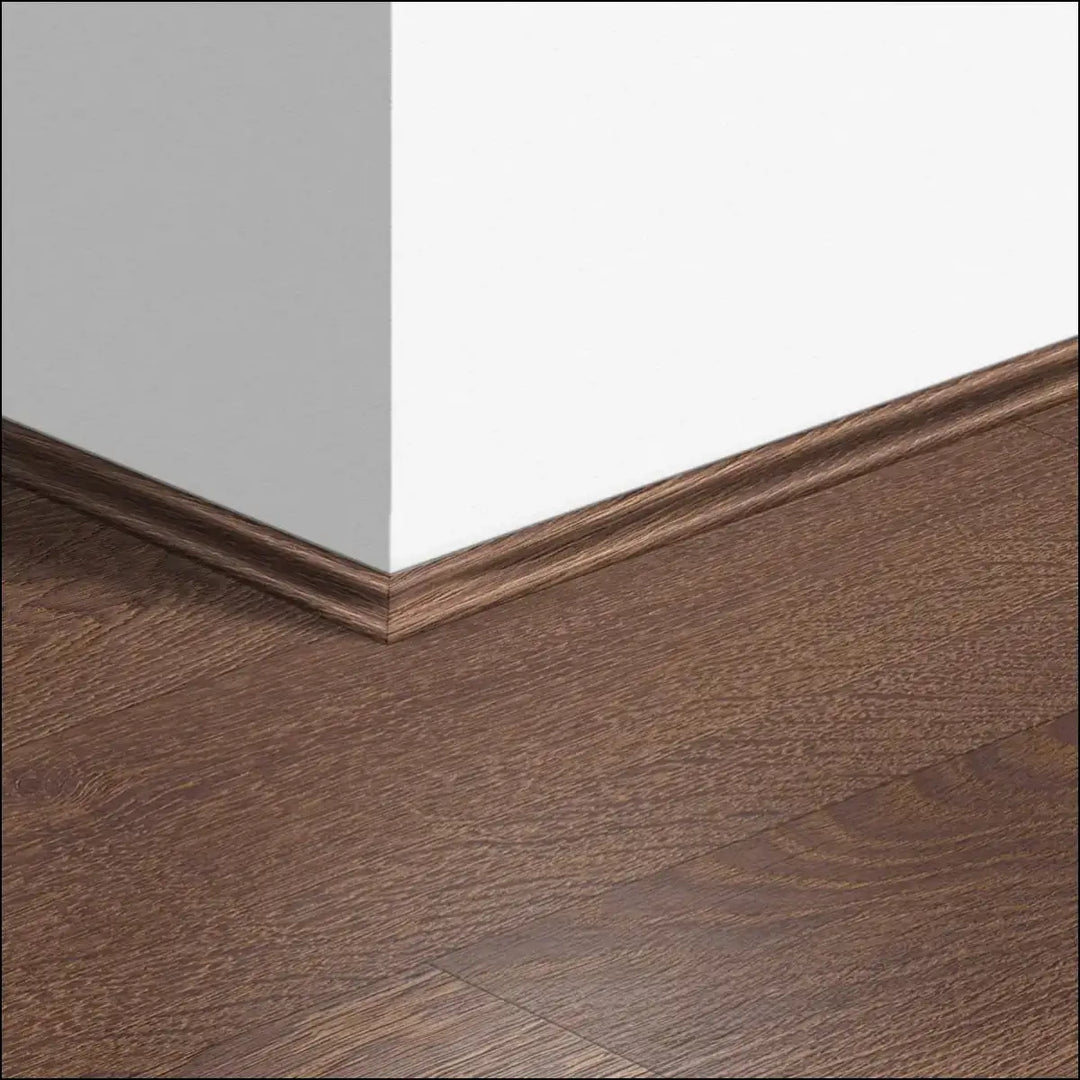 Dark brown wooden quickstep classic scotia beading baseboard with smooth polished finish for quick-step flooring