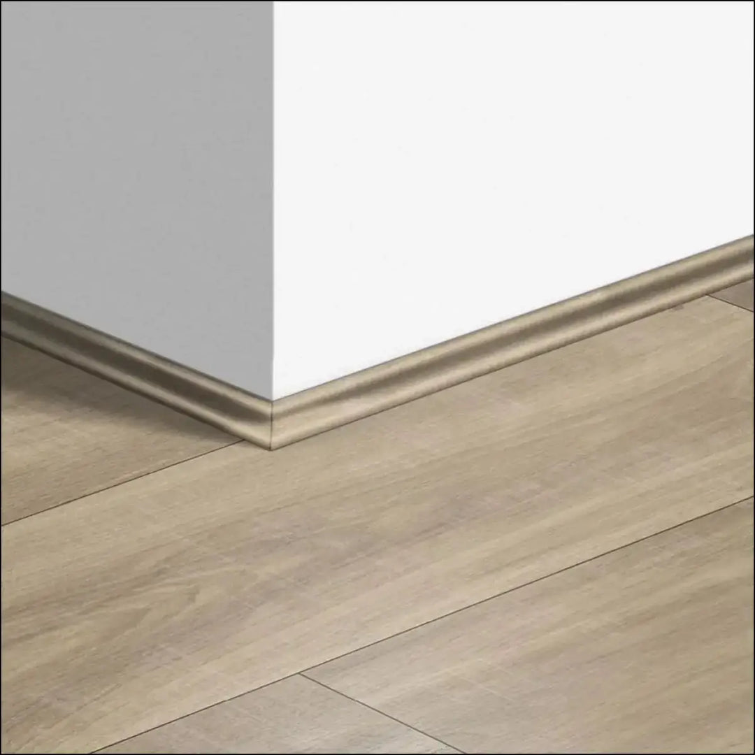 Beige wood-effect laminate baseboard with smooth raised profile for wall-floor junction from quickstep classic scotia beading