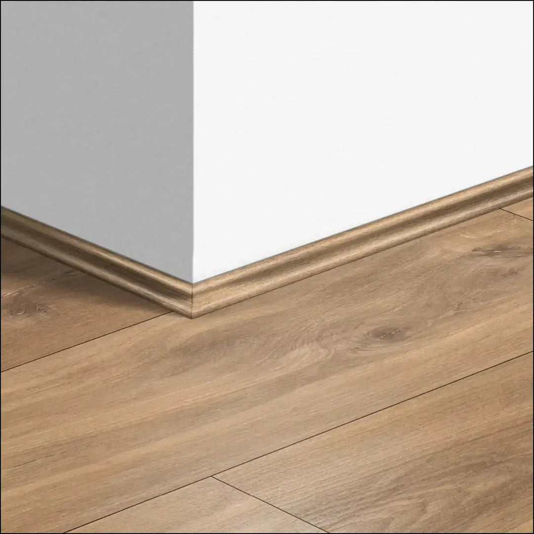 Light brown wooden quickstep classic scotia beading baseboard with subtle profile for quick-step flooring corners