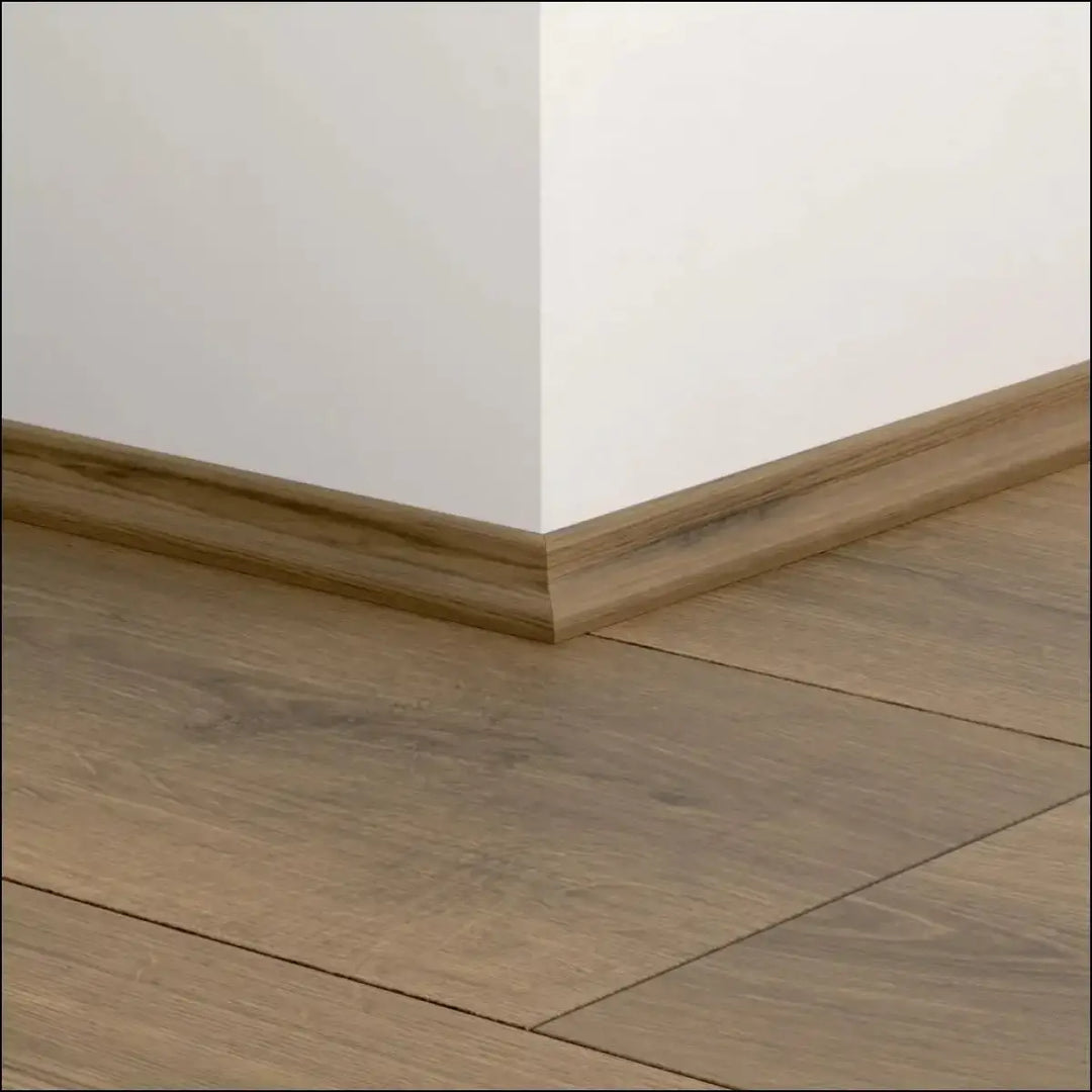 Light brown wood-grain quickstep classic scotia beading baseboard with smooth finished surface for quick-step flooring