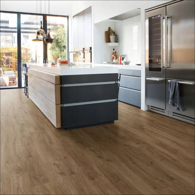 Light brown wood grain quickstep eligna laminate flooring in newcastle oak brown with smooth modern finish