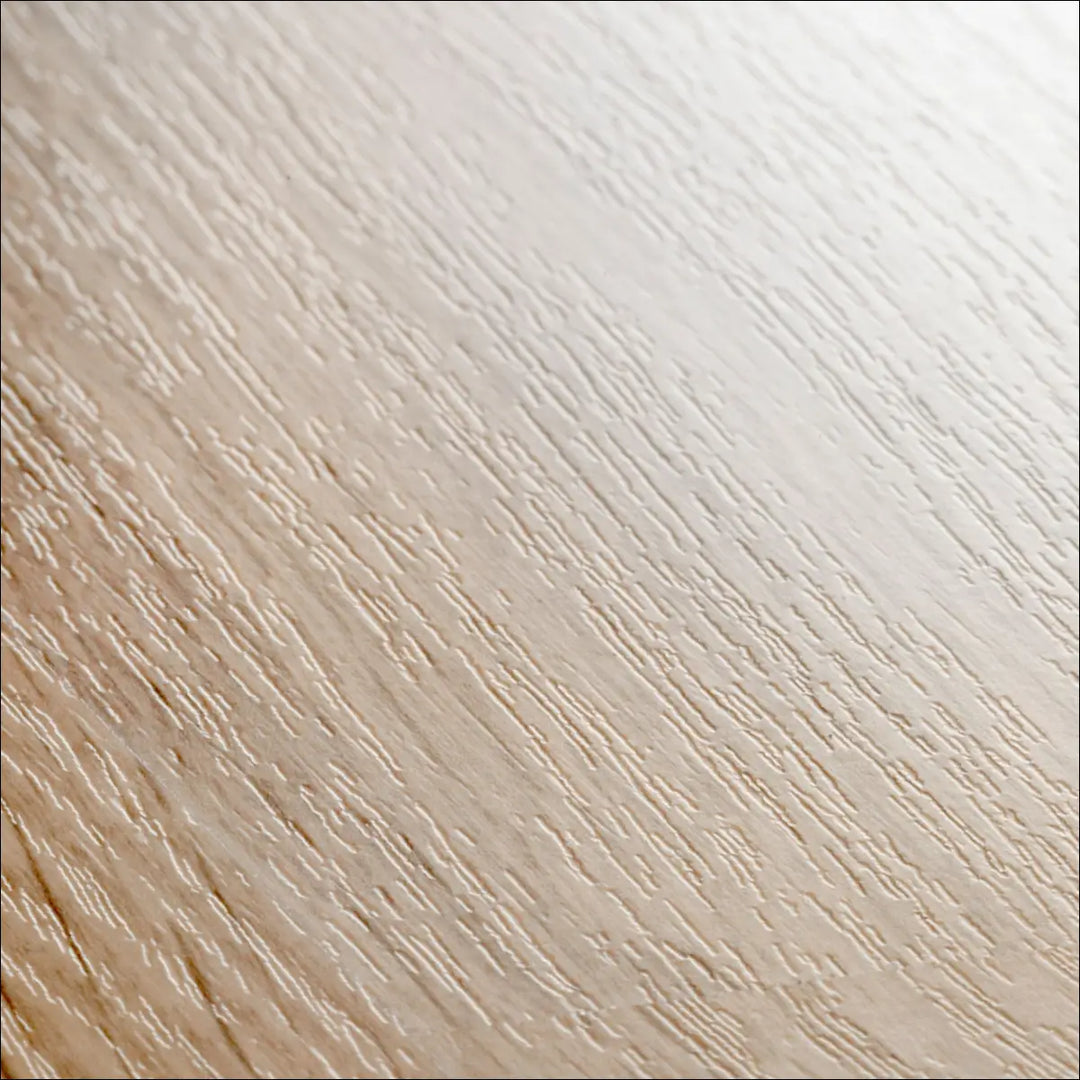Light-colored quickstep eligna laminate flooring in white varnished oak with a subtle natural wooden grain pattern