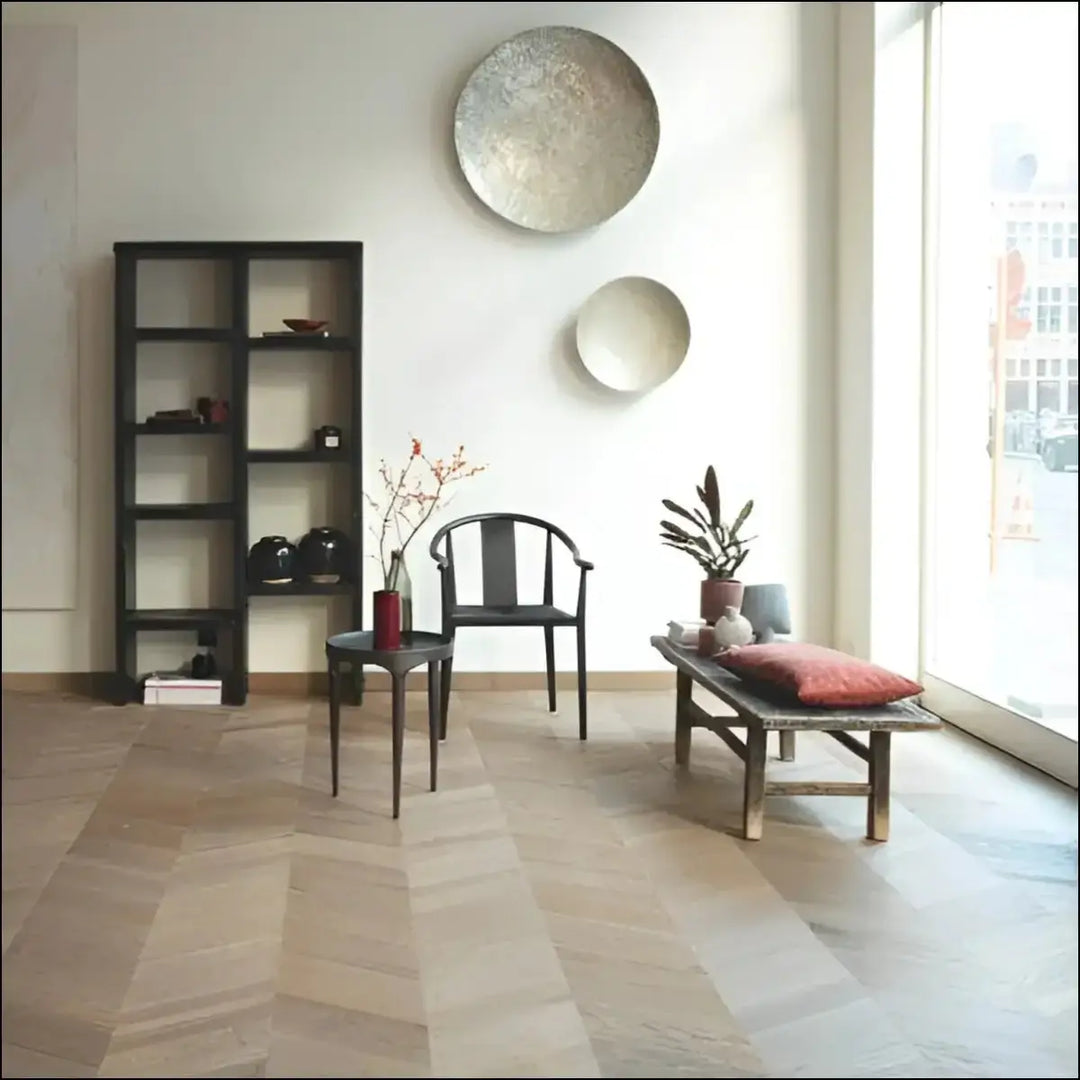 Two circular metallic wall art pieces with textured silver and smooth white discs complement quickstep intenso engineered eclipse oak oiled wood flooring