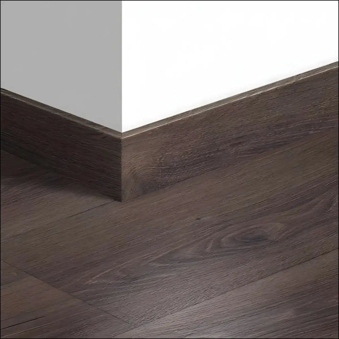 Dark brown wood-grain laminate quickstep majestic skirting boards 58mm with matching baseboard and floor