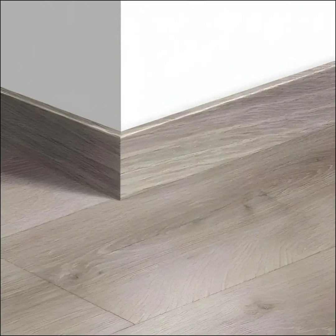 Gray wood-grain laminate quickstep majestic skirting boards 58mm with matte finish matching light gray flooring