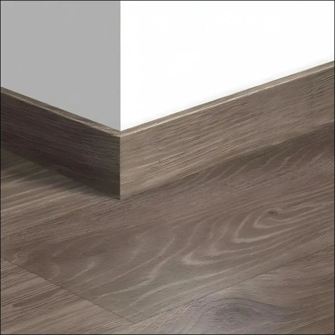 Gray wood-grain laminate quickstep majestic skirting board with subtle natural grain pattern for matching skirting boards